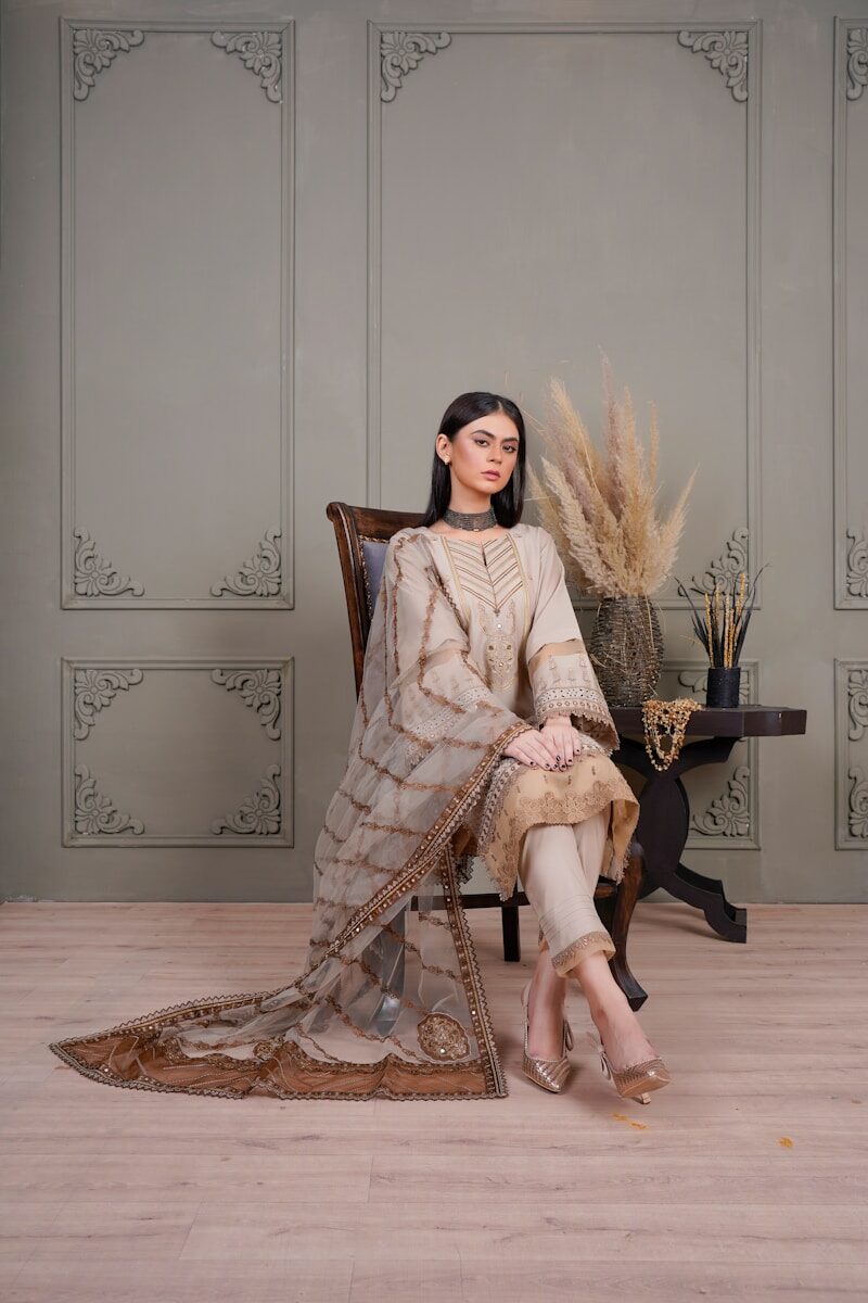 a woman sitting on a chair in a room