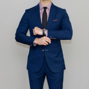 man in blue suit standing